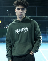 Person wearing a green hoodie with white text on a sports court